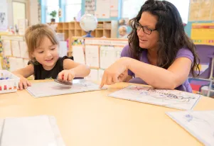 Preschool teacher with student