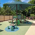 Shaded age-appropriate playscape in a secure outdoor playground